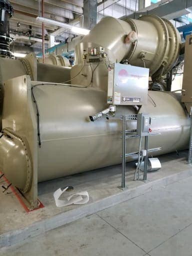 Side view of a Trane centrifugal water-cooled chiller in a mechanical room